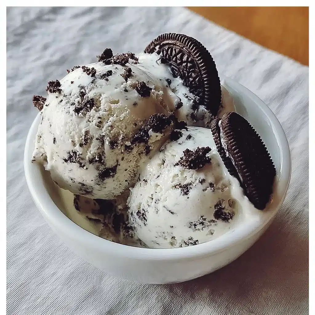 Delicious Cookies and Cream Ice Cream in a cone garnished with chocolate cookies.
