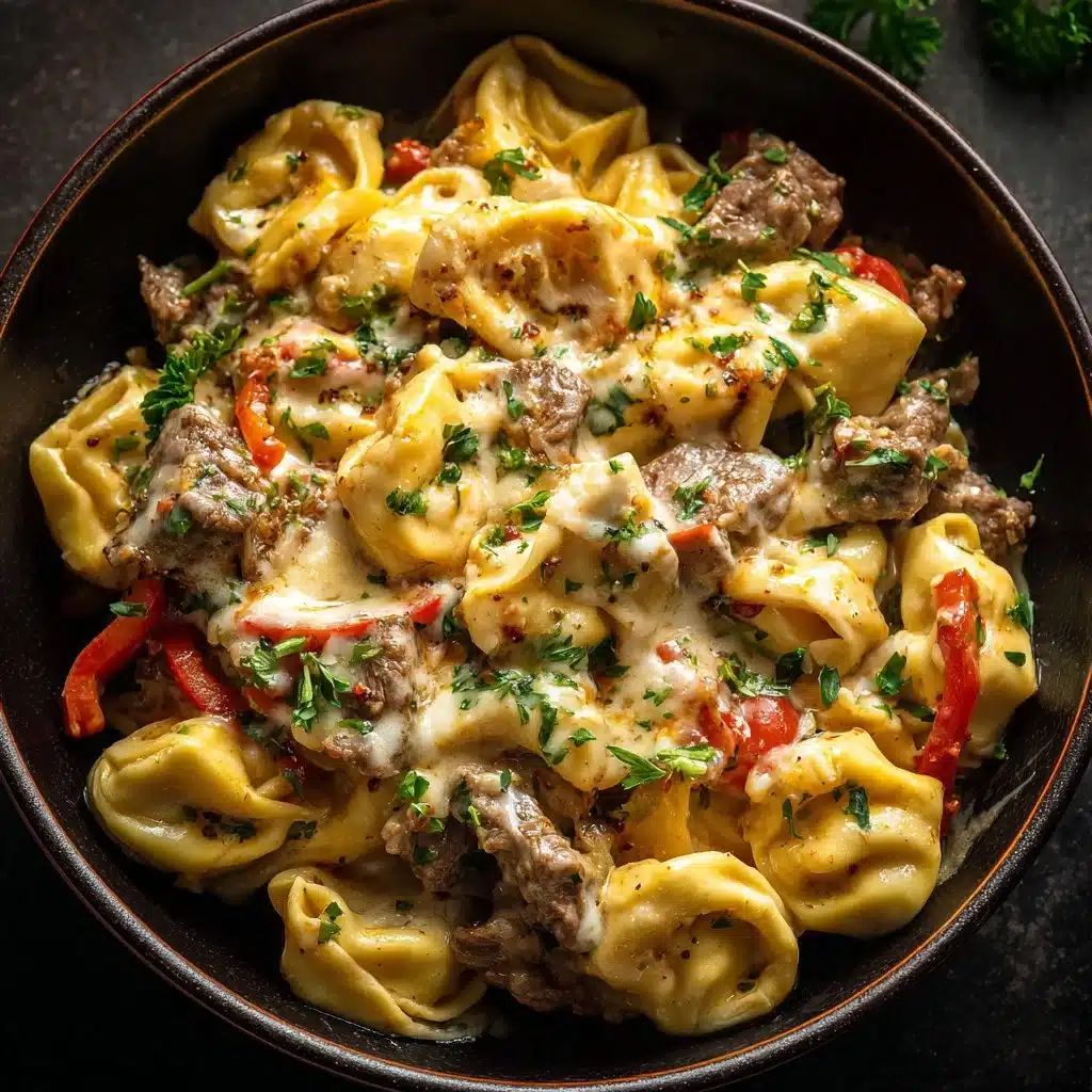 Crock Pot Cheesesteak Tortellini dish garnished and ready to serve