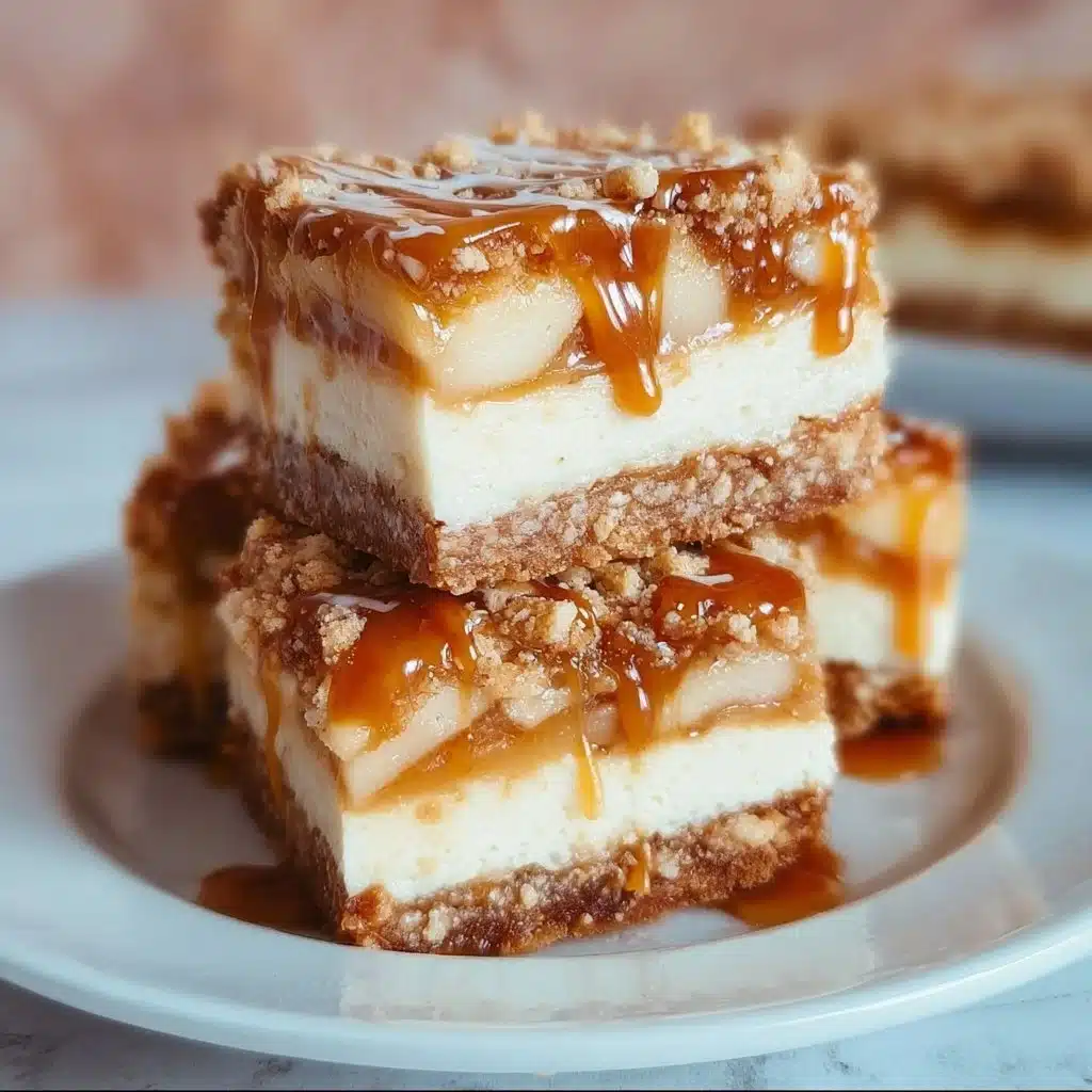 Delicious salted caramel apple cheesecake crunch bars layered with apple slices and caramel sauce.