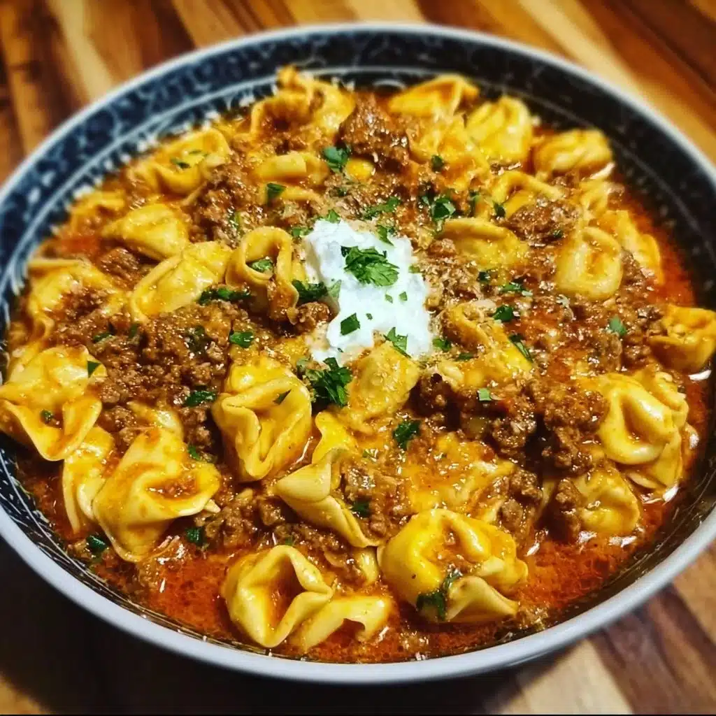 Delicious beef enchilada tortellini topped with cheese and fresh herbs